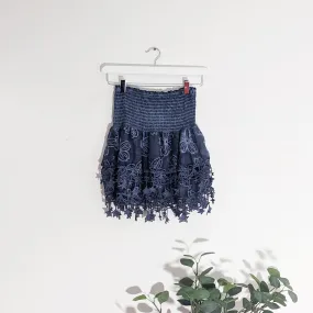 Layered mini skirt with elasticated waist and hanging star elements