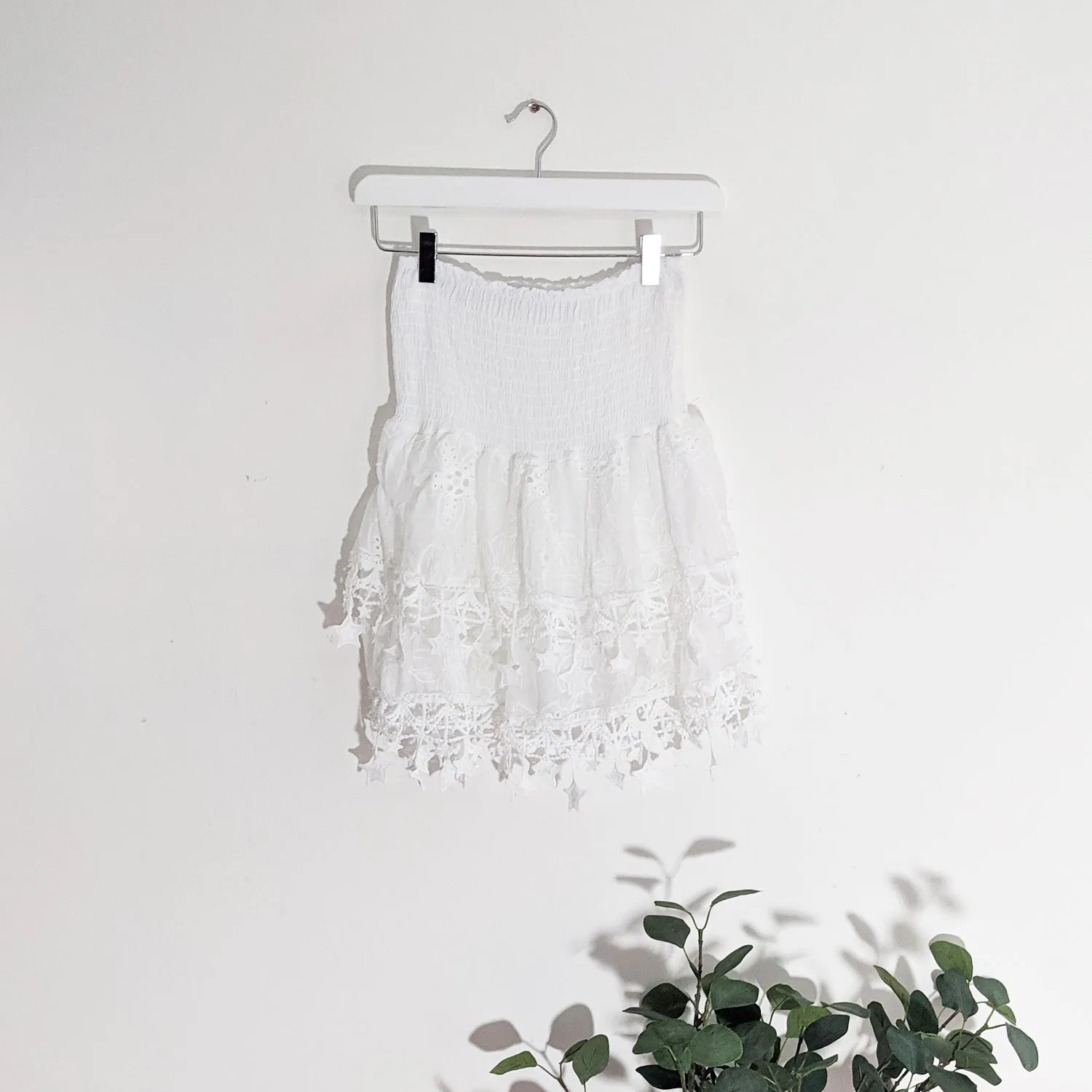 Layered mini skirt with elasticated waist and hanging star elements