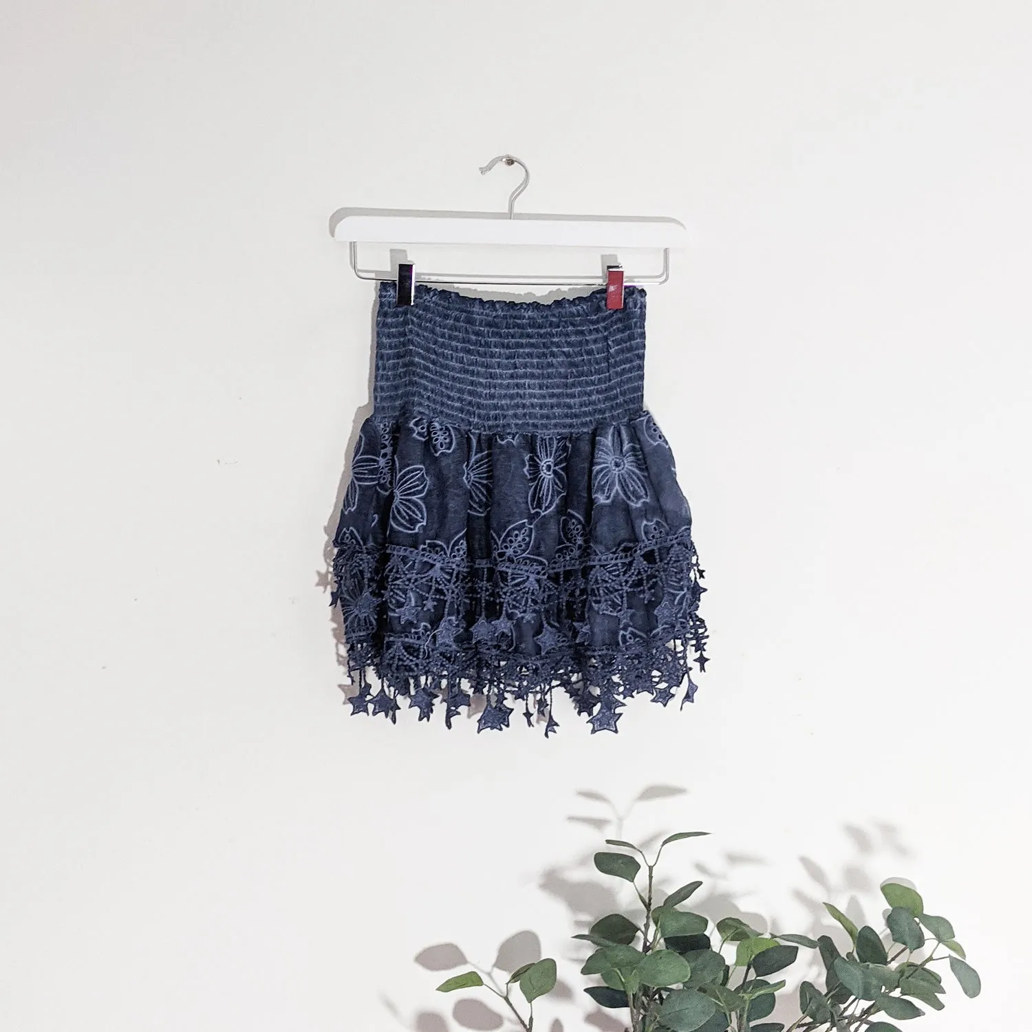 Layered mini skirt with elasticated waist and hanging star elements